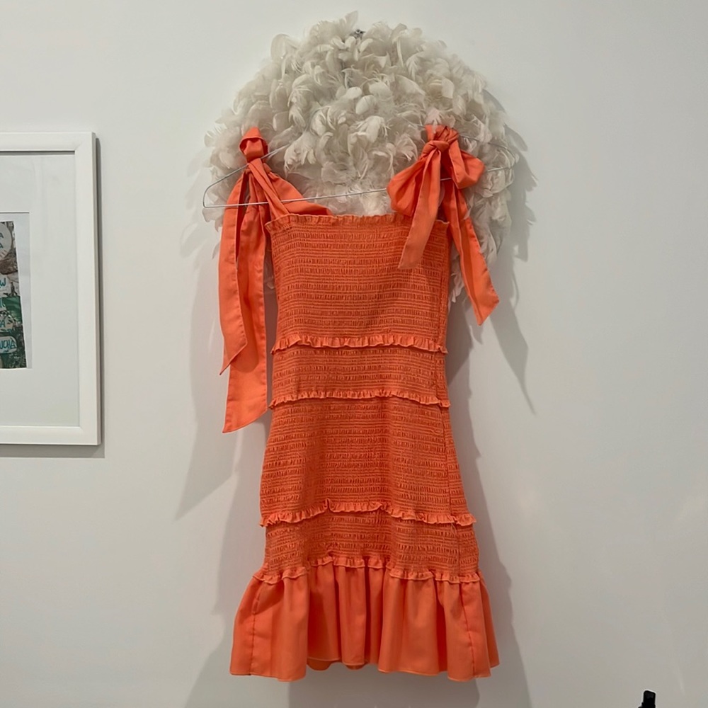Orange/ salmon colored tight fitted dress. Altard state size M.